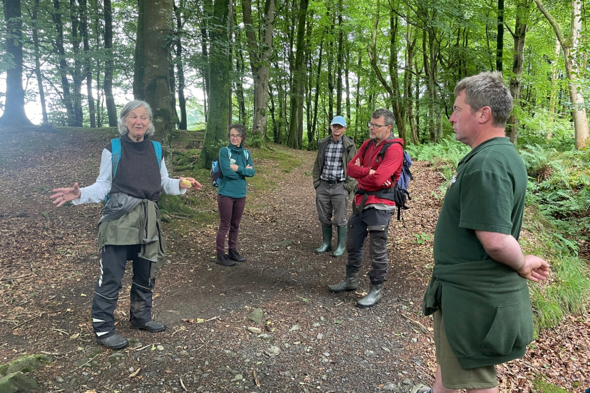 Community woodland group standing talking in Kilsture woodland