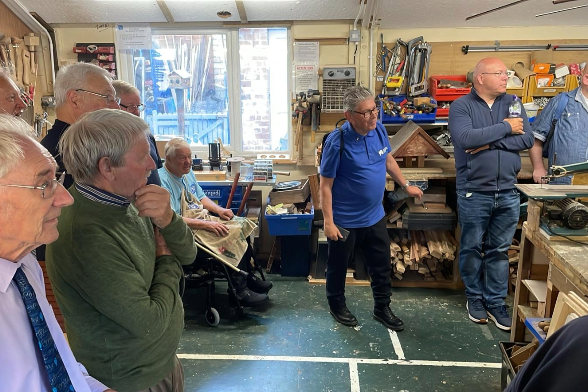A group of people in a tool/ 3D printing workshop