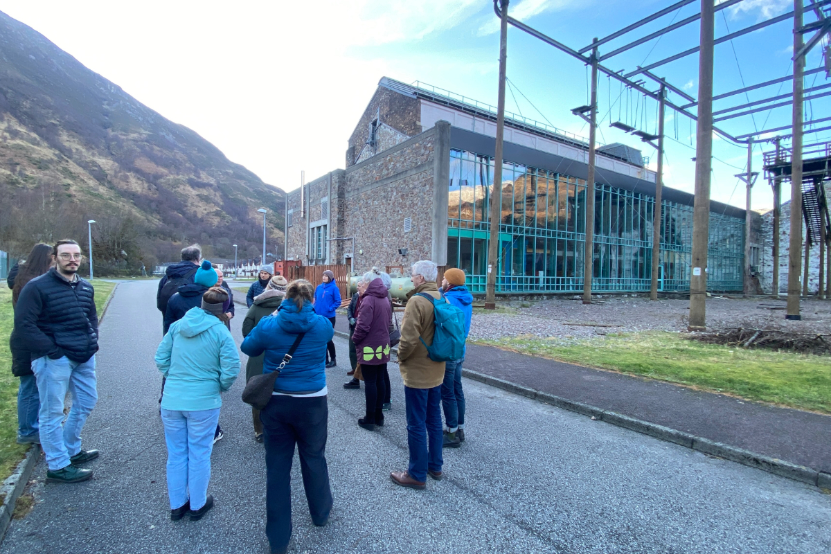 A group visiting a community owned building in Kinlochleven