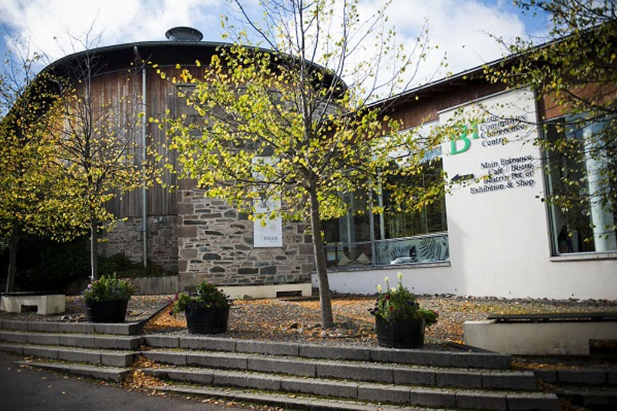 Image of Dunkeld & Birnam Arts Centre behind a row of trees
